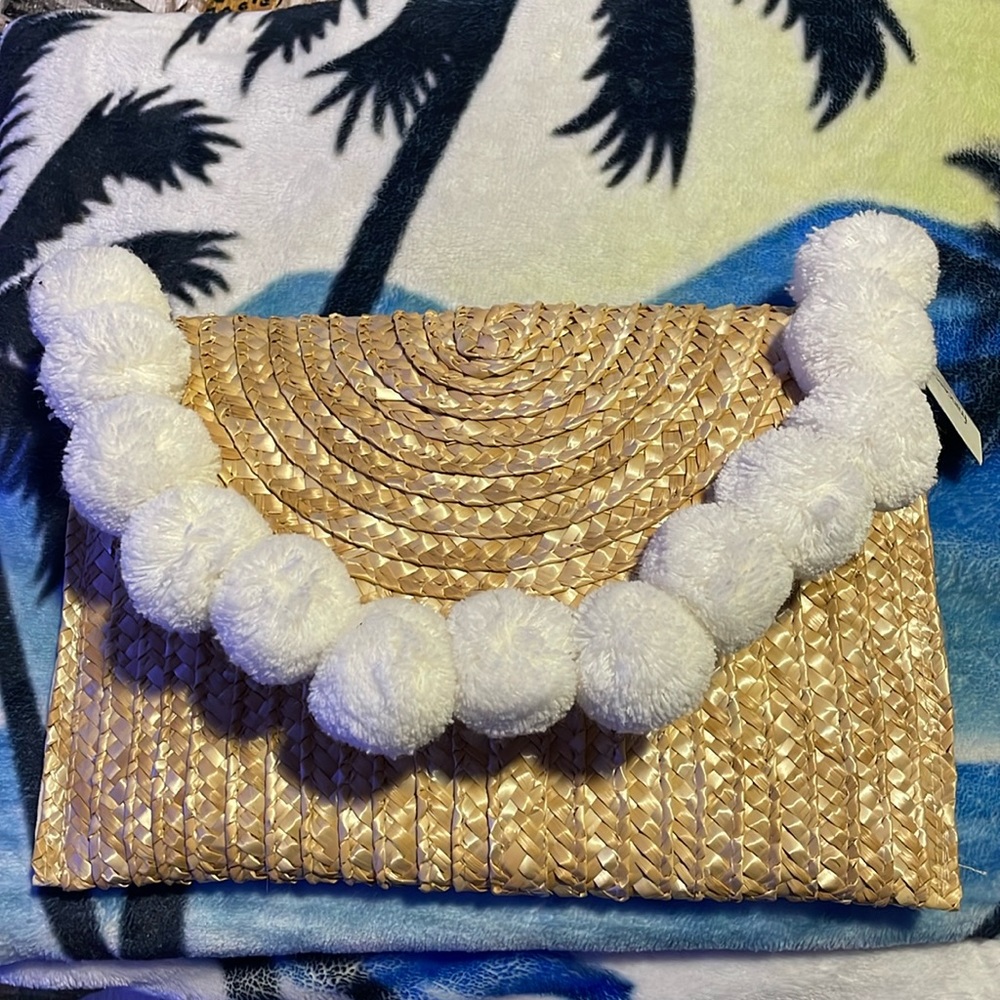 Francesca’s wheat clutch bag with tags